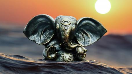 Ganesha Statue Basking in Sunset Glow wallpaper