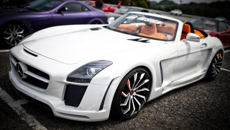 Sleek White Mercedes SLS AMG Under Bright Sunlight wallpaper