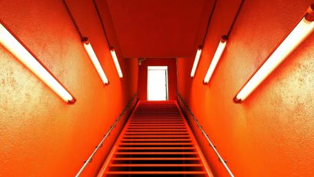 Vibrant Orange Staircase in Urban Setting wallpaper