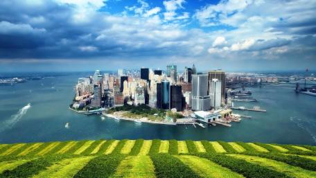 Vibrant Daytime Cityscape Overlooking Waterway wallpaper