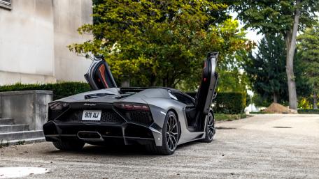 Luxury Black Lamborghini in a Stunning Setting wallpaper