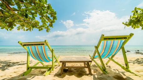 Sandy beach with sunloungers wallpaper
