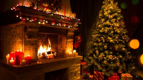 Candle light in the fireplace at Christmas wallpaper