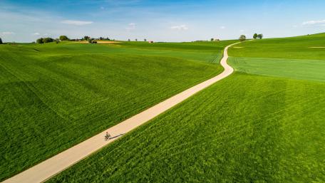 Long road in the green hills wallpaper