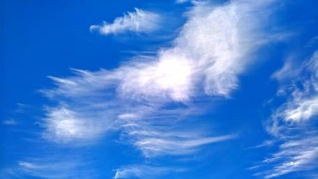Serene Clouds Against a Bright Blue Sky wallpaper