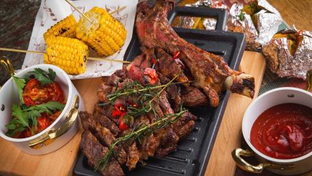 Grilling Delight with Juicy Meats and Sides wallpaper