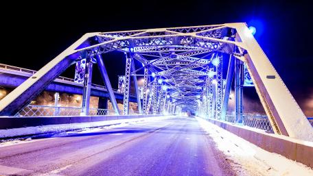 Vibrant Night Bridge Under Purple Lights wallpaper