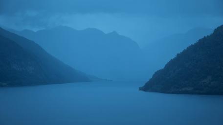 Tranquil Fjord Reflection in Blue Shades wallpaper