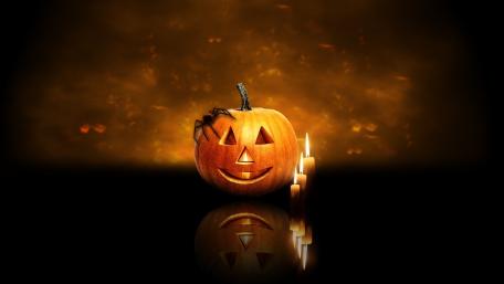 Spider on a pumpkin Jack O'lantern wallpaper