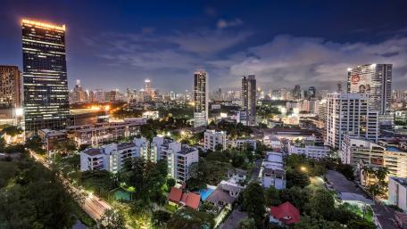Serene Cityscape at Dusk Illuminated by Night Lights wallpaper
