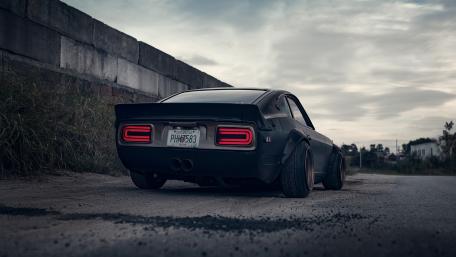 Classic Muscle Car on Urban Street Scene wallpaper