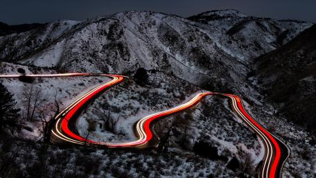 Mountain pass light trails wallpaper