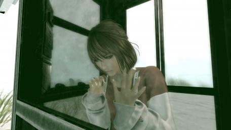 Sad woman looks out the window wallpaper