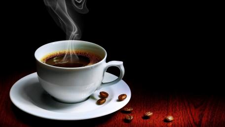 Hot steaming cup of coffee wallpaper
