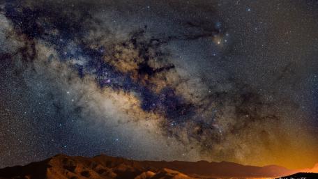 Milky way above the mountains wallpaper