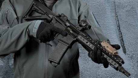 Ready for Action: Elite Soldier with Advanced Rifle wallpaper