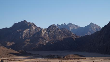 Majestic Mountain Range Under Clear Sky wallpaper