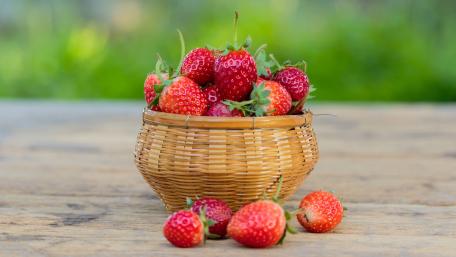 Fresh Strawberries in a Rustic Basket wallpaper