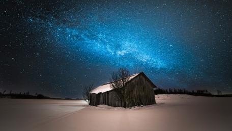 Milky way  over the snowy hut wallpaper