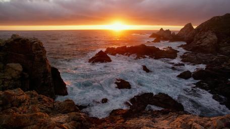 Sunset Over Rocky Shores wallpaper
