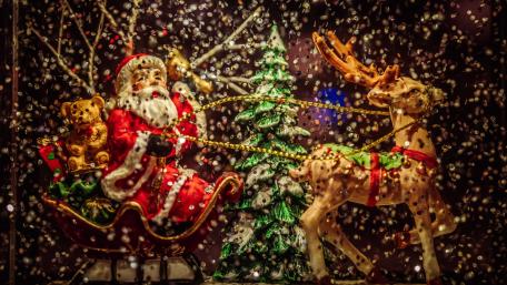 Festive Wonderland with Santa Claus and Reindeer wallpaper