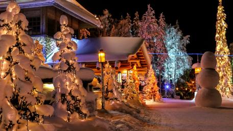 Winter Wonderland Christmas Scene with Lights and Snowman wallpaper