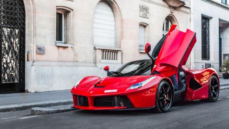 Red Ferrari LaFerrari on City Streets wallpaper