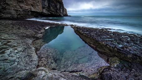 Cloudy seashore wallpaper