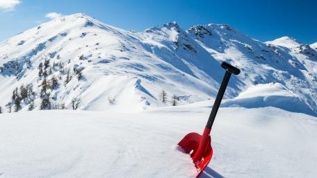 Snow shovel in the snow wallpaper