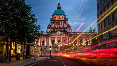 Evening Cityscape with Light Trails and Landmark Dome wallpaper
