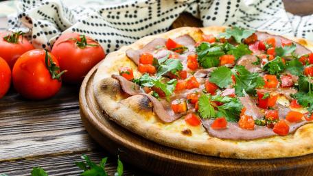 Delicious Italian Pizza with Fresh Ingredients wallpaper