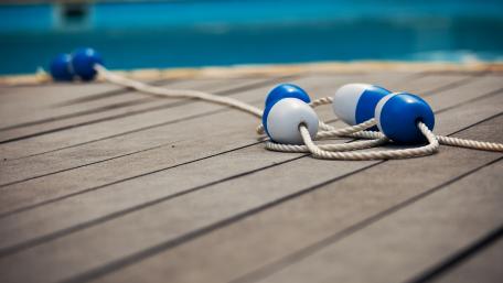 Sporty Poolside Vibes with Blue Floats wallpaper