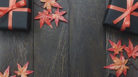 Autumn Celebration Gifts with Leaves and Wood Planks wallpaper