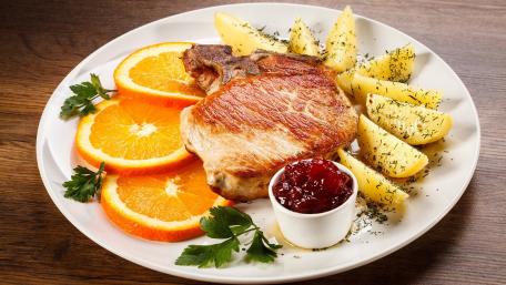 Savory Meat Chop with Fresh Accompaniments wallpaper