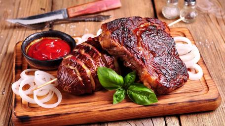 Sizzling BBQ Feast on Rustic Planks wallpaper