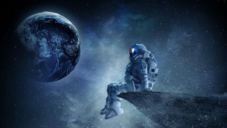 Asronaut sitting on the edge wallpaper