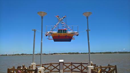Colorful Boat Installation Over Water wallpaper