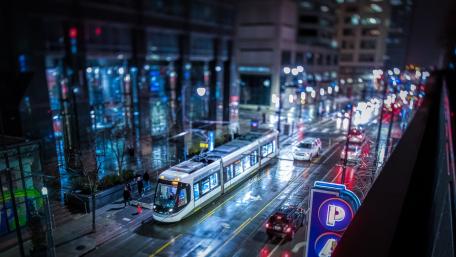 Urban Nightscape with Trams and City Lights wallpaper