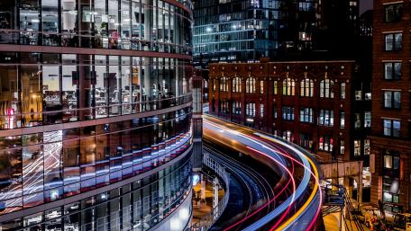 Light trails among the buildings wallpaper