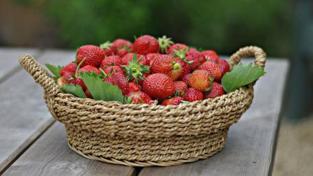 Fresh Strawberries Overflowing from a Basket wallpaper
