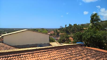 Serene Rooftop View Over Lush Landscapes wallpaper