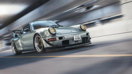 Dynamic Silver Sports Car in Motion wallpaper