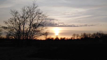 Sunset Serenity Over a Quiet Landscape wallpaper