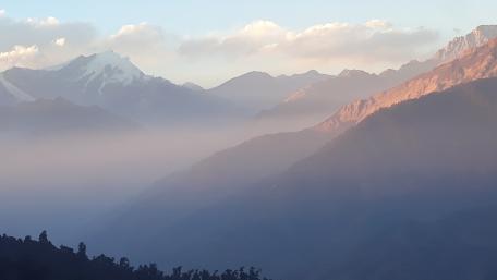 Serene Mountain Mist Over Majestic Ridges wallpaper