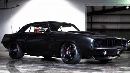 Sleek Vintage Muscle Car in Spotlight wallpaper