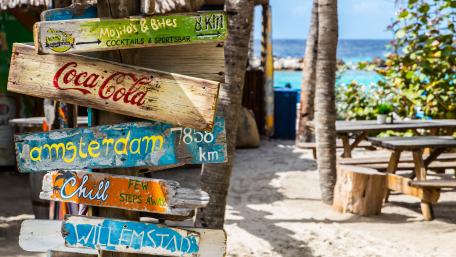Wooden Sign on Mambo Beach wallpaper