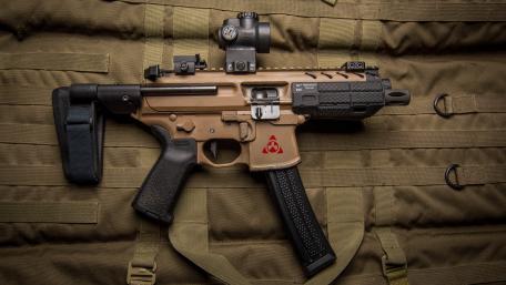 Precision and Power: Modern Tactical Firearm Closeup wallpaper