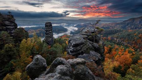 Majestic Autumn Sunset Over Cliffs and Forests wallpaper