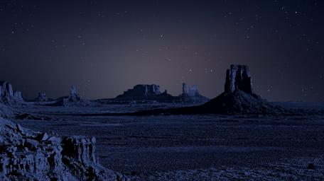 Buttes under the starry night sky wallpaper