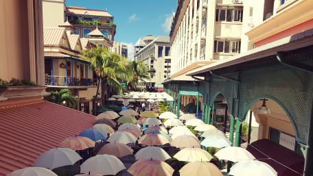 Charming Umbrellas Create Vibrant Urban Scene in Mauritius wallpaper